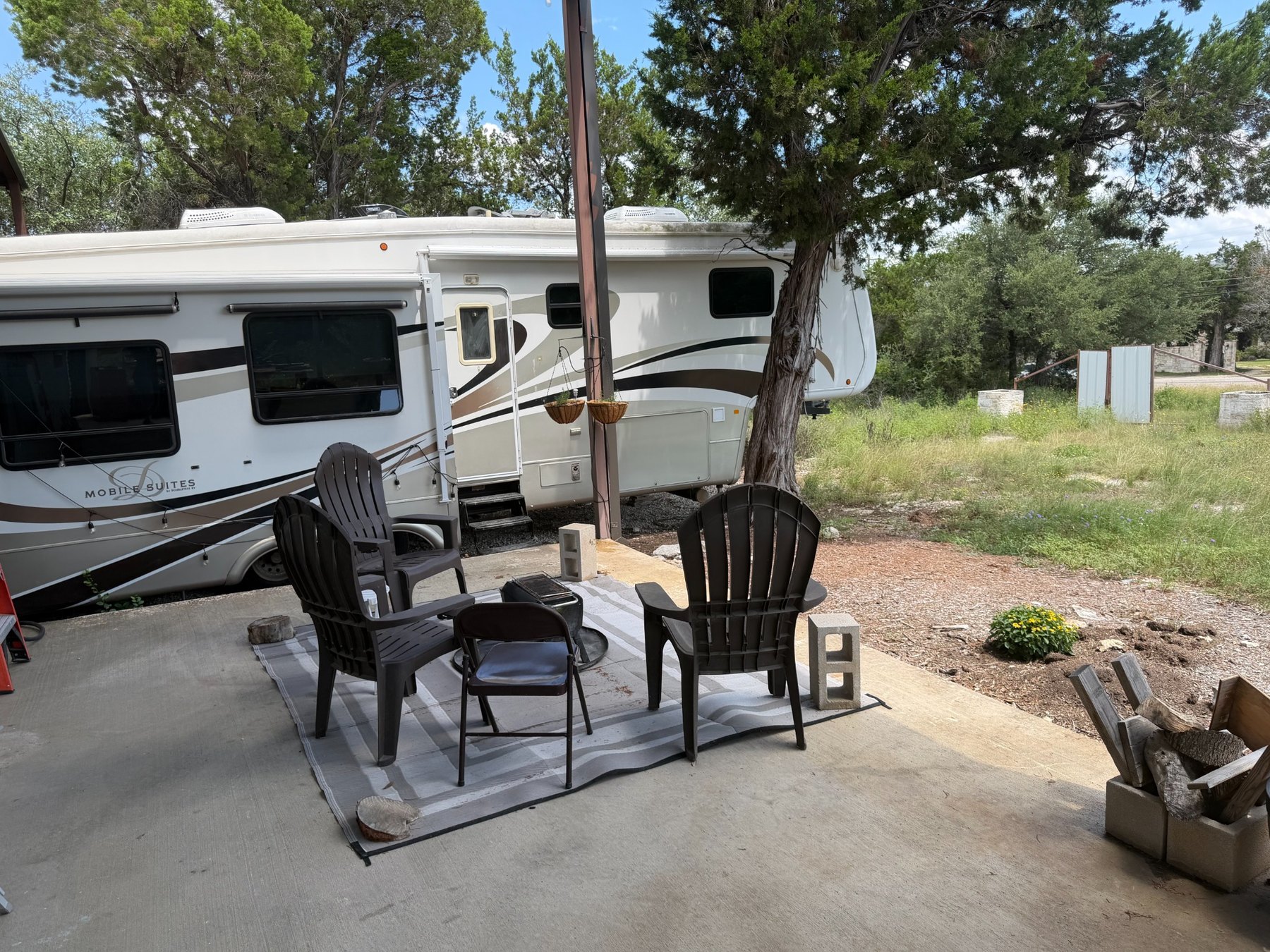Outdoor seating area beside the Chamomile Hour RV retreat
